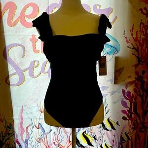 NWT women’s one piece black bathing suit. Ruffle sleeves open back.